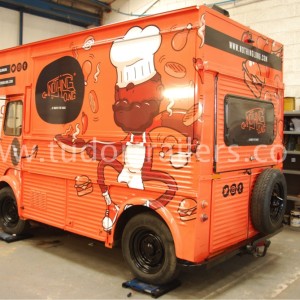 side view of Jamaican catering Hvan with vehicle wrapping