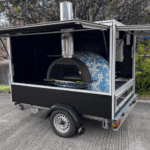 Compact catering trailer with pizza oven
