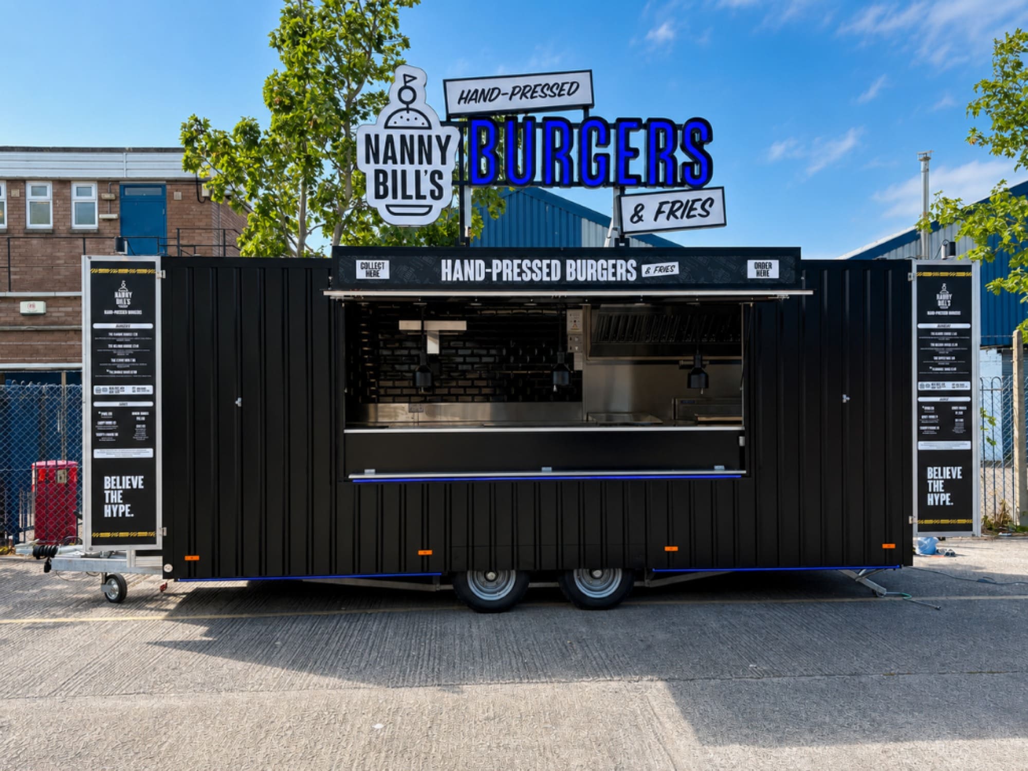 Nanny Bill’s bespoke burger trailer with custom illuminated signage, branded exterior, menu boards and professional street food kitchen.